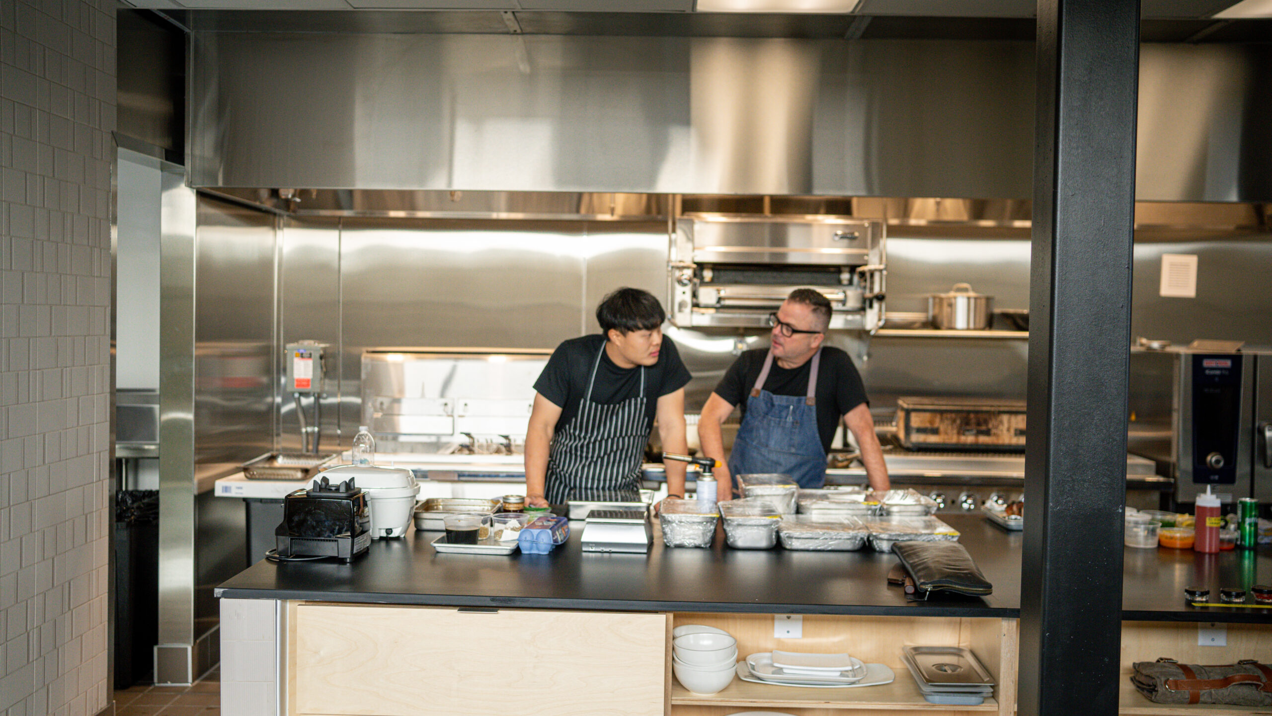 DSC3934 two men in a shiny kitchen