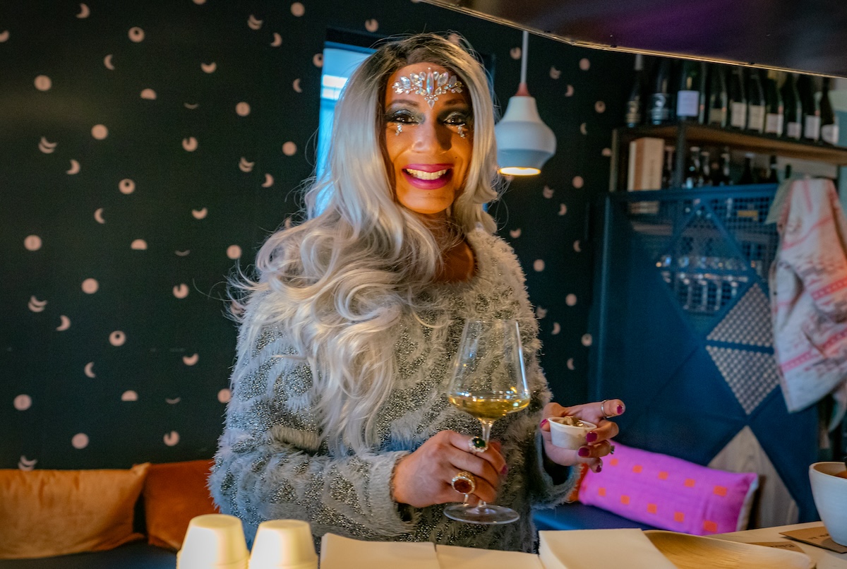 drag queen with cocktail