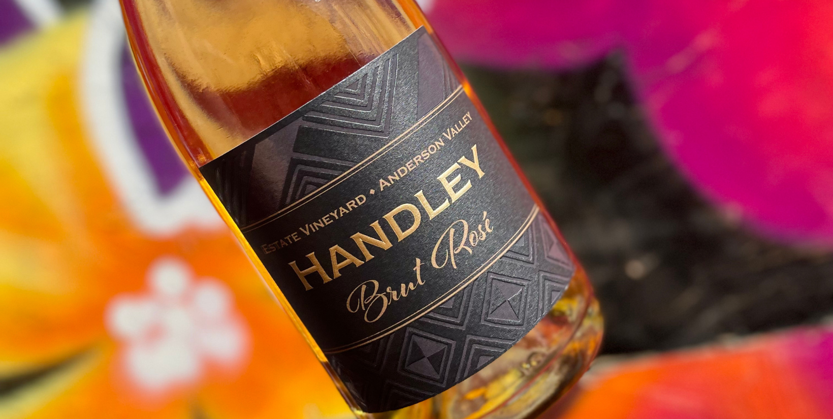 Since it’s impossible to choose just one wine at Noble Riot, check out this bonus bottle: Handley Cellar’s Estate Vineyard Brut Rosé 2016. This stunning wine comes to Dever through the collection by Master Sommelier, Doug Krenik. A mentor of mine and a legend in the Colorado wine industry, Doug Krenik Selections brings an array of small-production artisan wines to restaurants and retail shops around the state.
The wine is a gorgeous copper hue made from a blend of Pinot Noir and Chardonnay in Mendocino’s Anderson Valley. It’s packed with flavors of kiwi, citrus, and freshly baked bread. Absolute perfection on the Noble Riot patio!