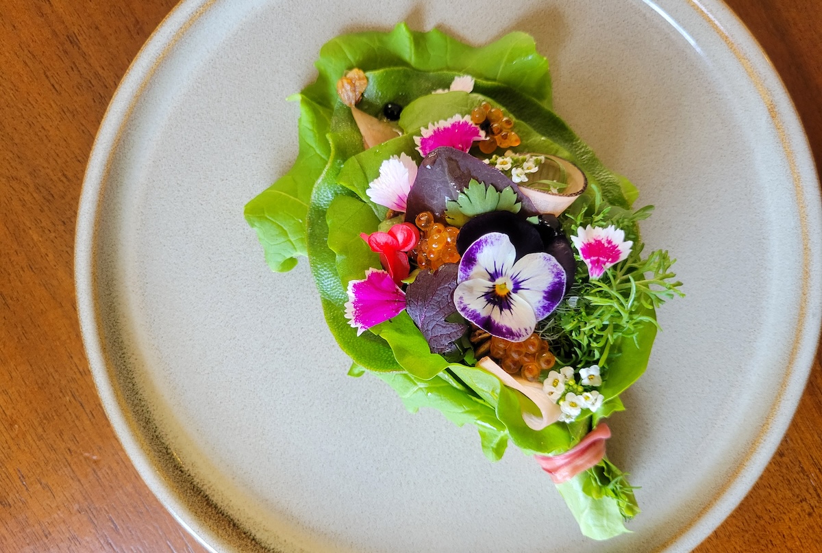 white plate with bright veggies