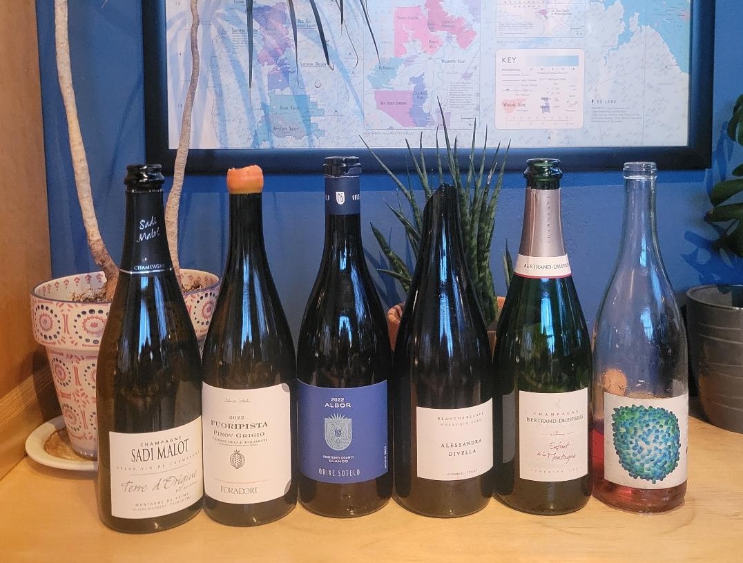 bottles of wine lined up on counter