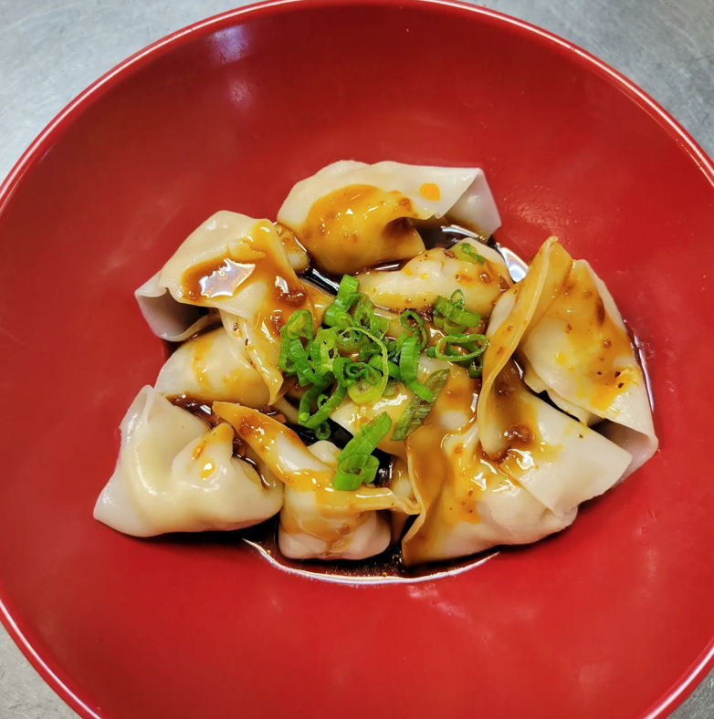 Located within an unassuming strip mall in Federal Heights, the culinary gem known as Yummy Dumpling awaits your discovery. This eatery allows you to explore the depths of its Chinese-inspired culinary menu. It's the dumplings, however, that steal the spotlight, offering a selection of ten delicious options for your discerning palate.
Whether you fancy the comforting warmth of a savory soup dumpling, the delicate perfection of a steamed masterpiece, the crispy embrace of a fried delight, or the fluffy indulgence of buns, Yummy Dumpling presents a variety of choices to satisfy your culinary desires. Here, dumplings transcend the ordinary, inviting you to embark on a gastronomic journey that promises nothing short of pure delight.