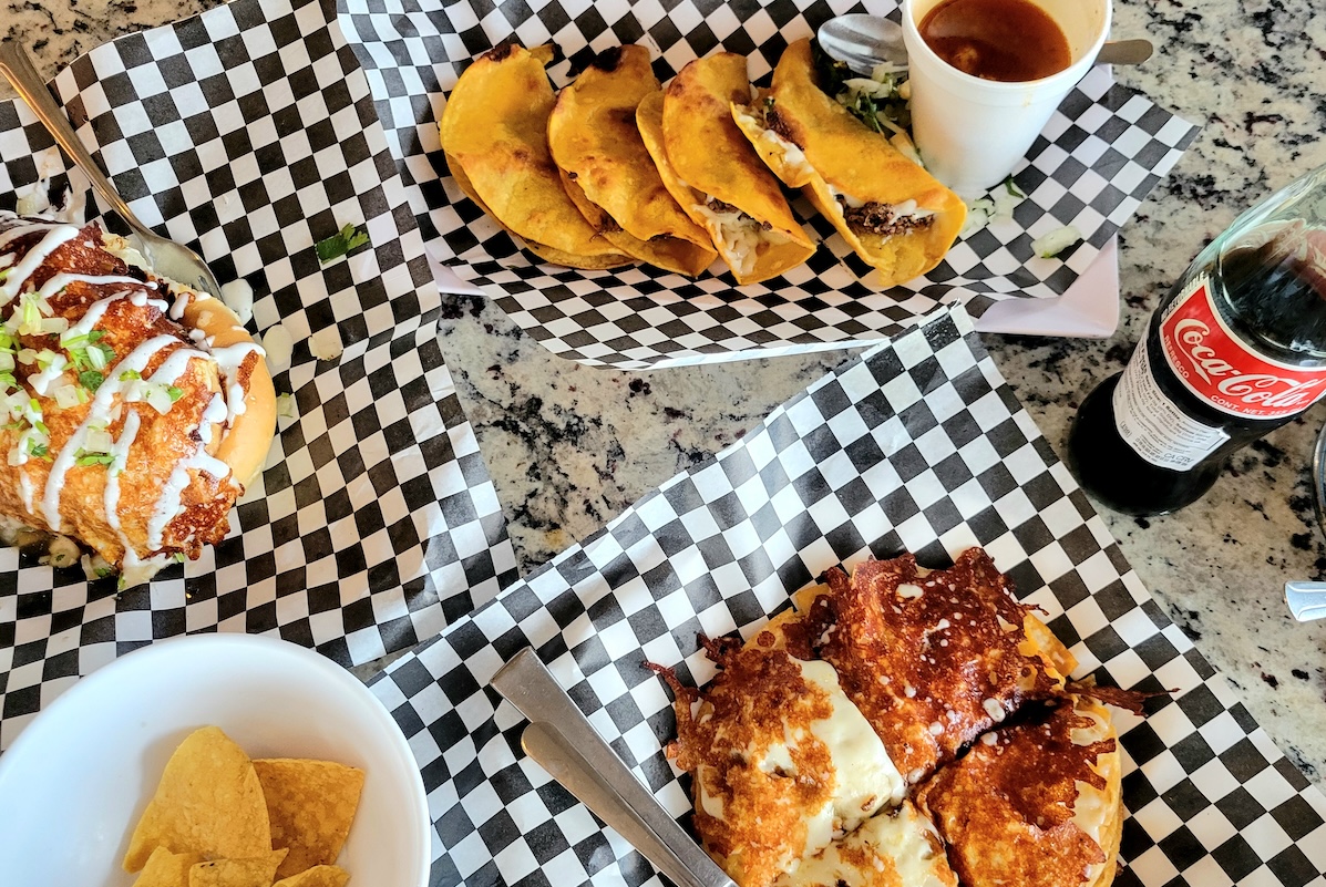 checkered paper with mexican food and a coke Birrieria Y Taqueria Los Tecos