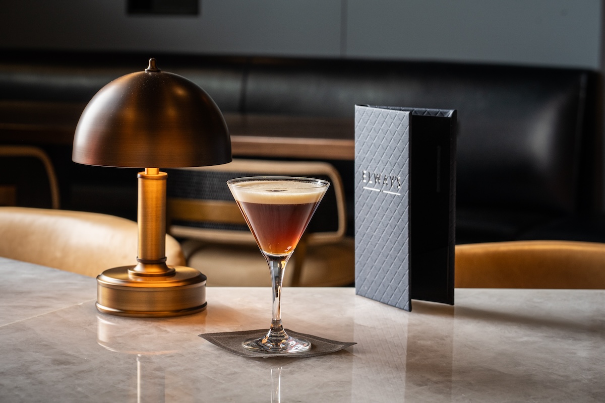 diningout-featured-image-2024 espresso martini next to menu on table