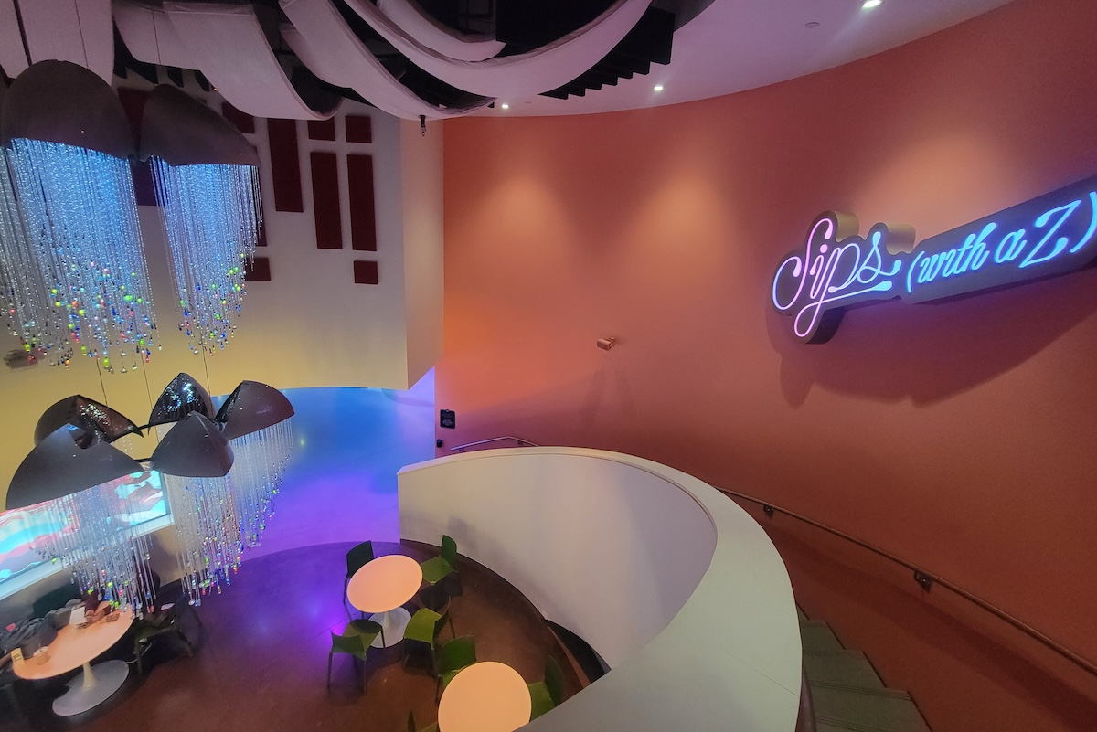 peach wall with neon sign