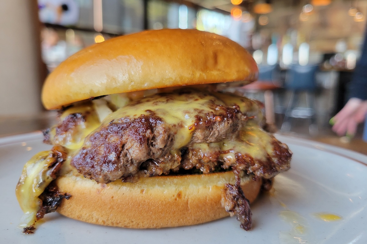 Get a smash burger at Atomic Cowboy. | Photo by Linnea Covington