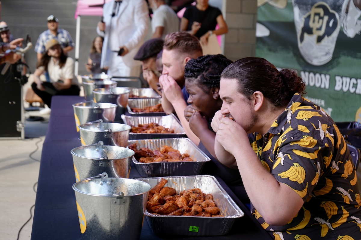 Joe Orth didn't win the wing eating contest, but he tried hard and even said he could eat more wings after it was over. | Photo by Kevin Fox