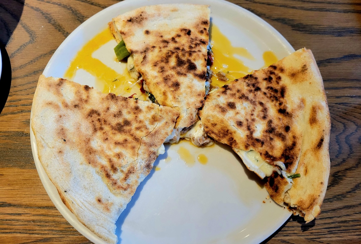 piada_parisi_by_covington Piada is basically a delicious Italian sandwich you can find at Parisi Pizzeria, Trattoria e Vino. | Photo by Linnea Covington