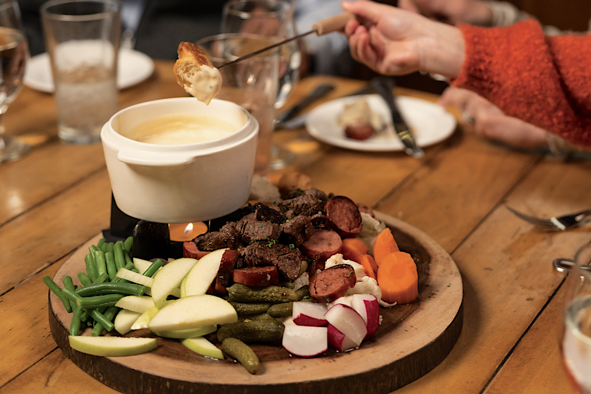 6 Zachs_Cabin_by_Vail_Resorts Share fondue with the whole table. | Photo by Vail Resorts