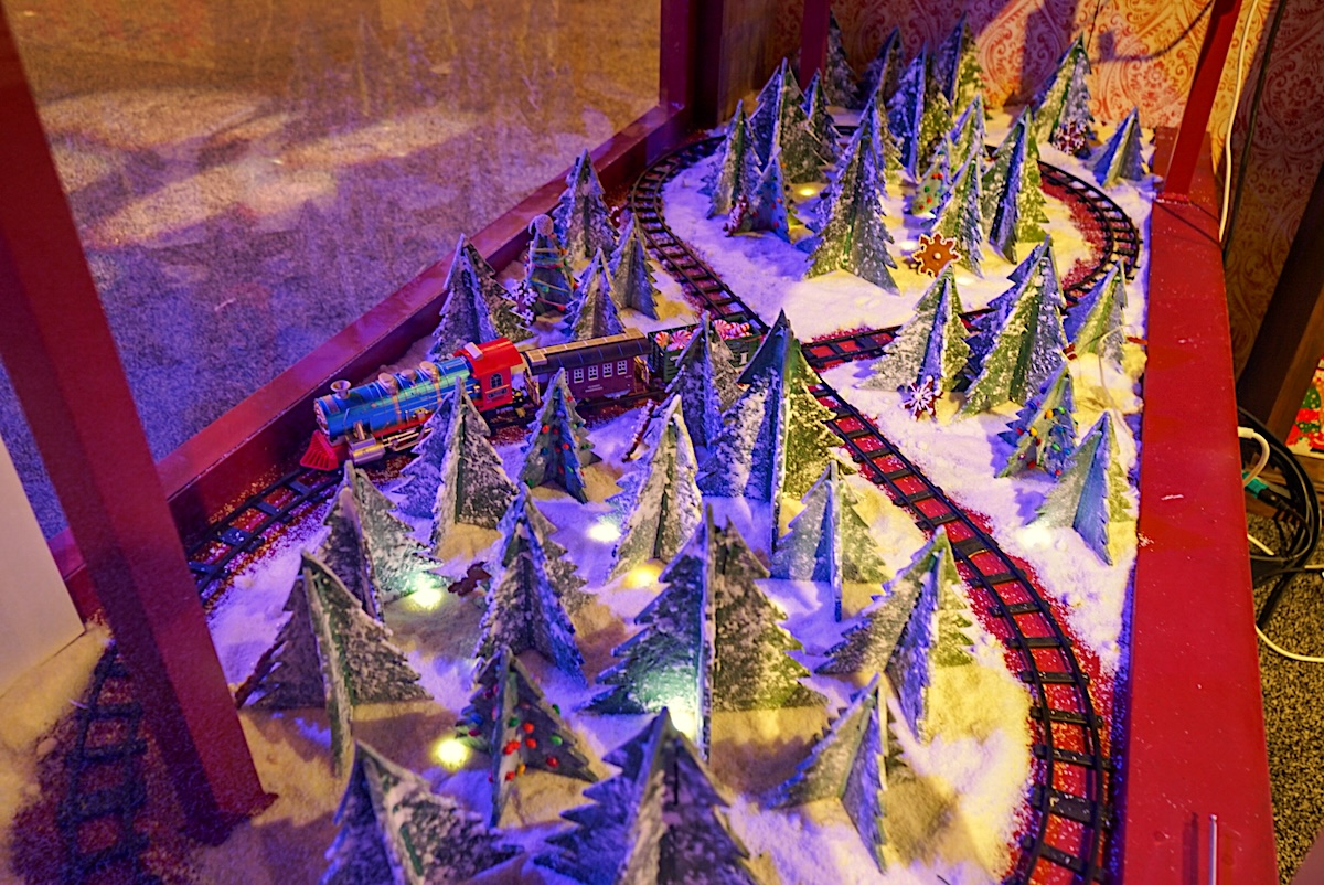 gingerbread_village_train_gaylord_rockies_2024 Dedication behind an epic gingerbread house