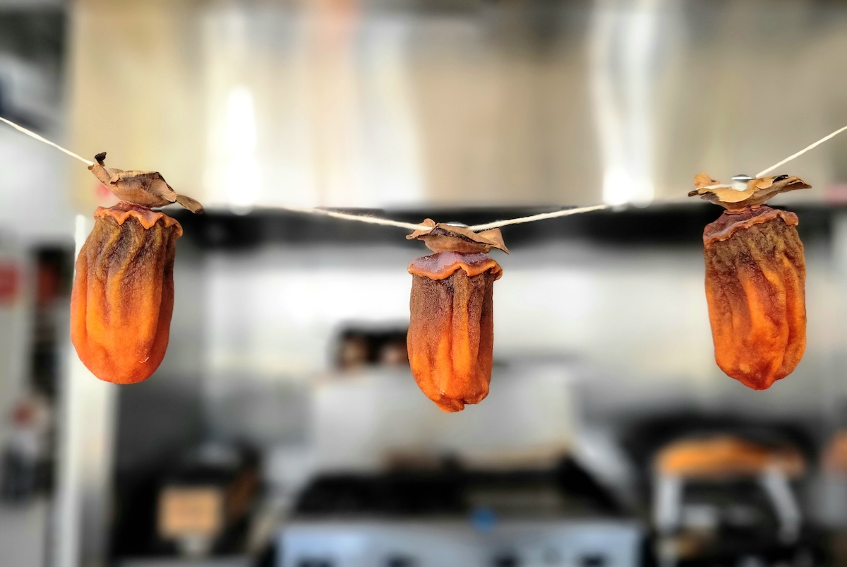 up_nxt_den_persimmons_by_covington The team uses techniques they learned from working with Id Est, such as kakishibu, or fermented persimmon. | Photo by Linnea Covington