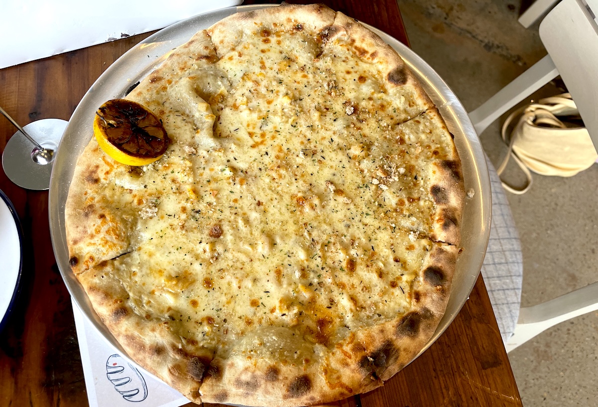 The newly opened Leven Supply makes pizza, including one with clams. | Photo by Sara Rosenthal