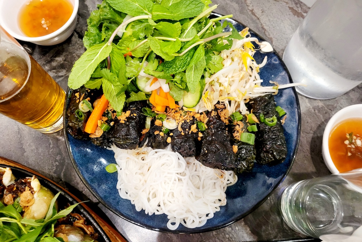 Bò Lá Lốt at Dan Da, a betel leaf and sausage DIY roll platter. | Photo by Linnea Covington