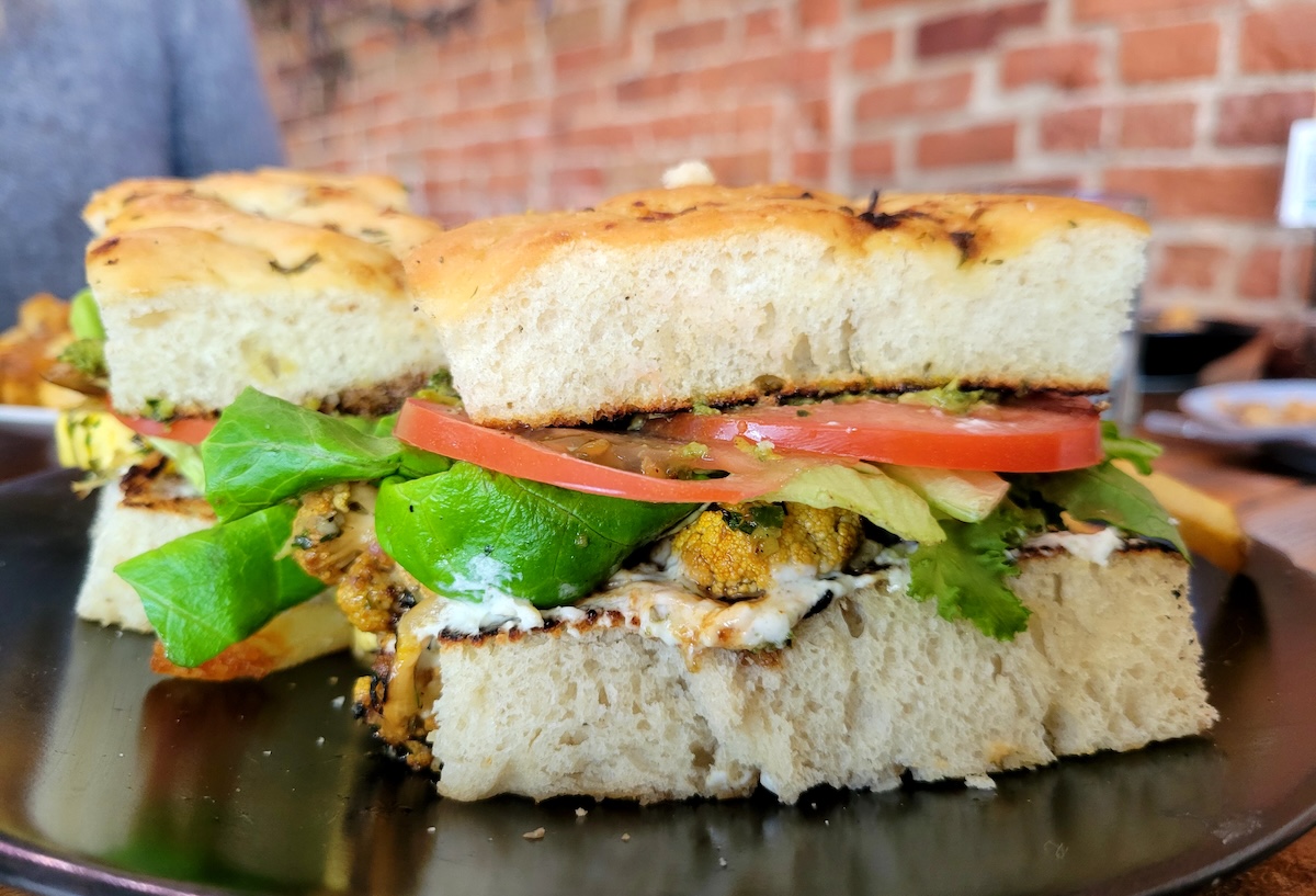 Seasonal Vegetable Pesto Sandwich at Sullivan Scrap Kitchen. | Photo by Linnea Covington