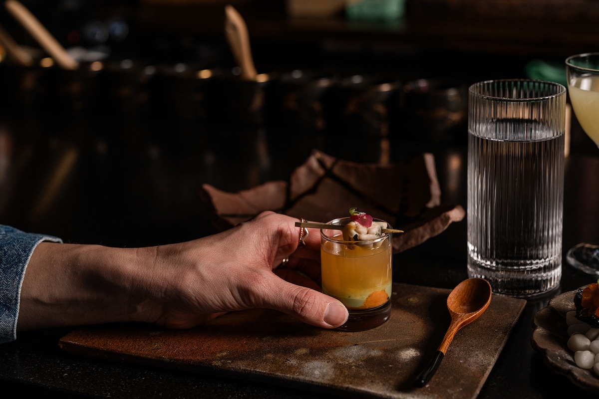 Green mussel and sea urchin sake shooter at Sushi By Scratch. | Photo by Larimer Square Marketing