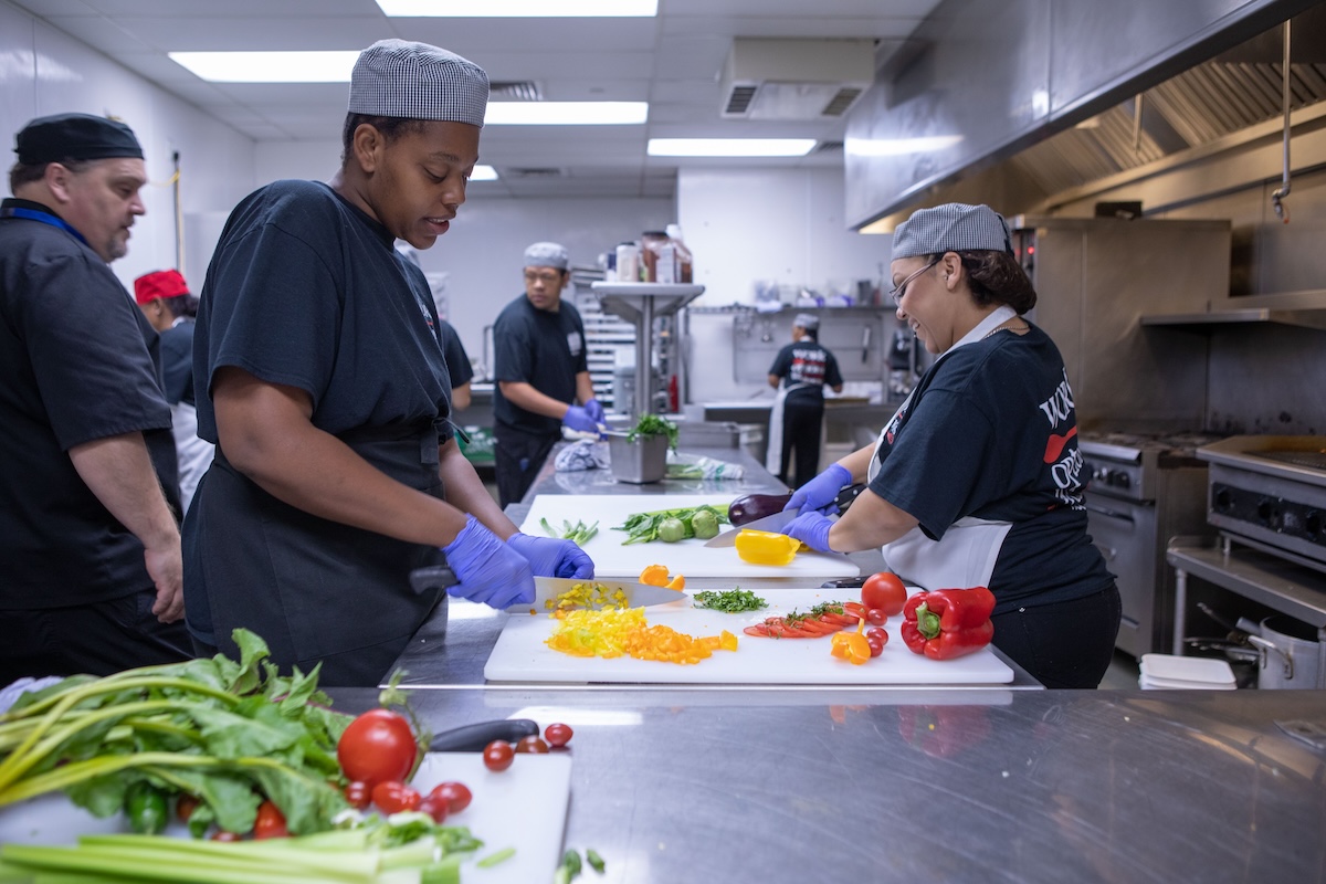 work_options_Busy Kitchen The teaching kitchen is busy all the time as students learn the proper way to prepare food. Photo by Work Options