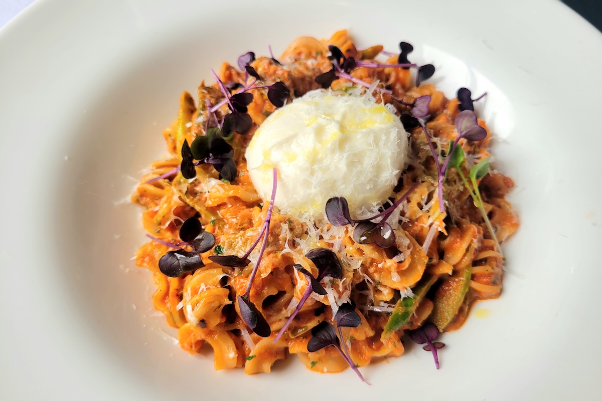 Radiatori tossed in vodka sauce with burrata, asparagus, and pecorino at Bella Colibri. | Photo by Linnea Covington