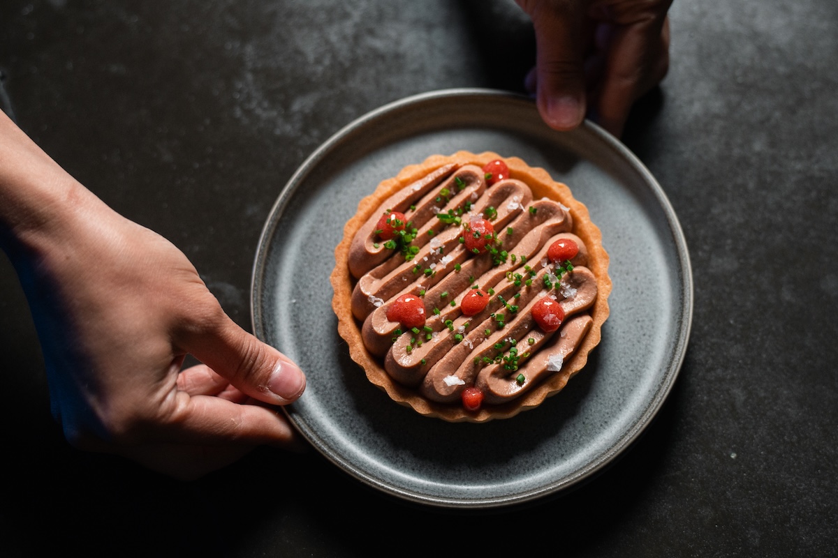 The Chicken Liver Tart is a throwback from the chefs' former restaurant. | Photo by Jeff Fierberg