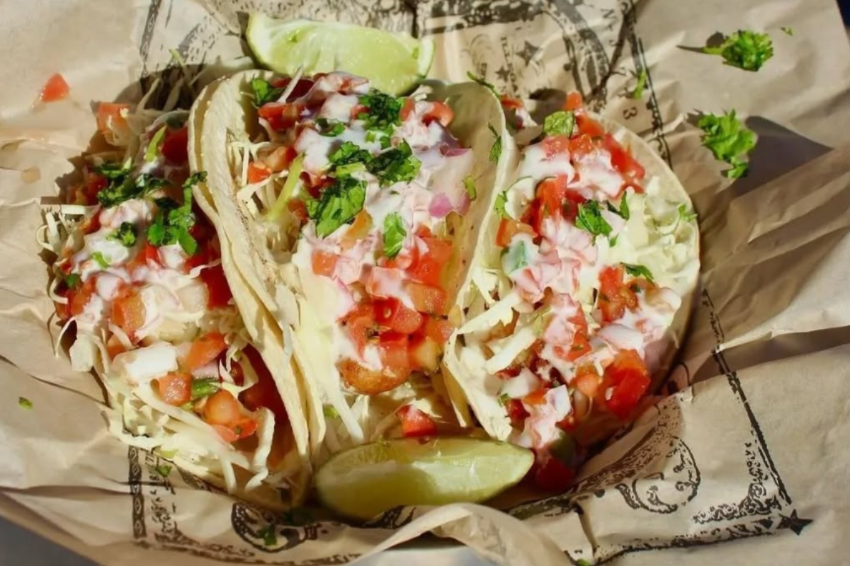 illegal petes park hill Three tacos with shredded cabbage, pico de gallo, and lime wedges at Illegal Pete’s in Denver, served in a casual foil-lined basket.