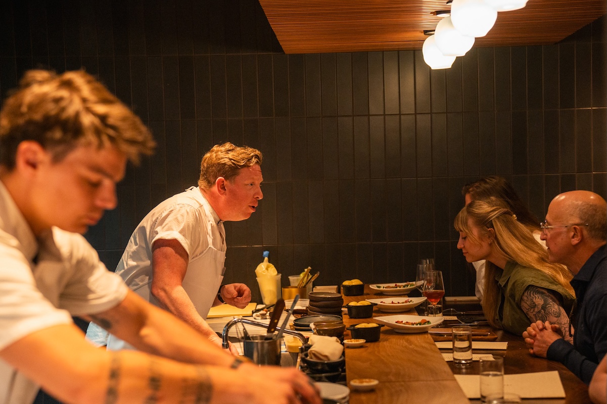 margot_by_jeff_fierberg_justin Chef Justin Fulton chats with guests at his chef's counter. | Photo by Jeff Fierberg