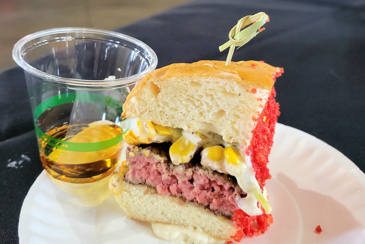 Great_divide_belmar_burger_chicken_fight_2025 Great Divide Belmar coated the burger with hot Cheeto dust. | Photo by Linnea Covington