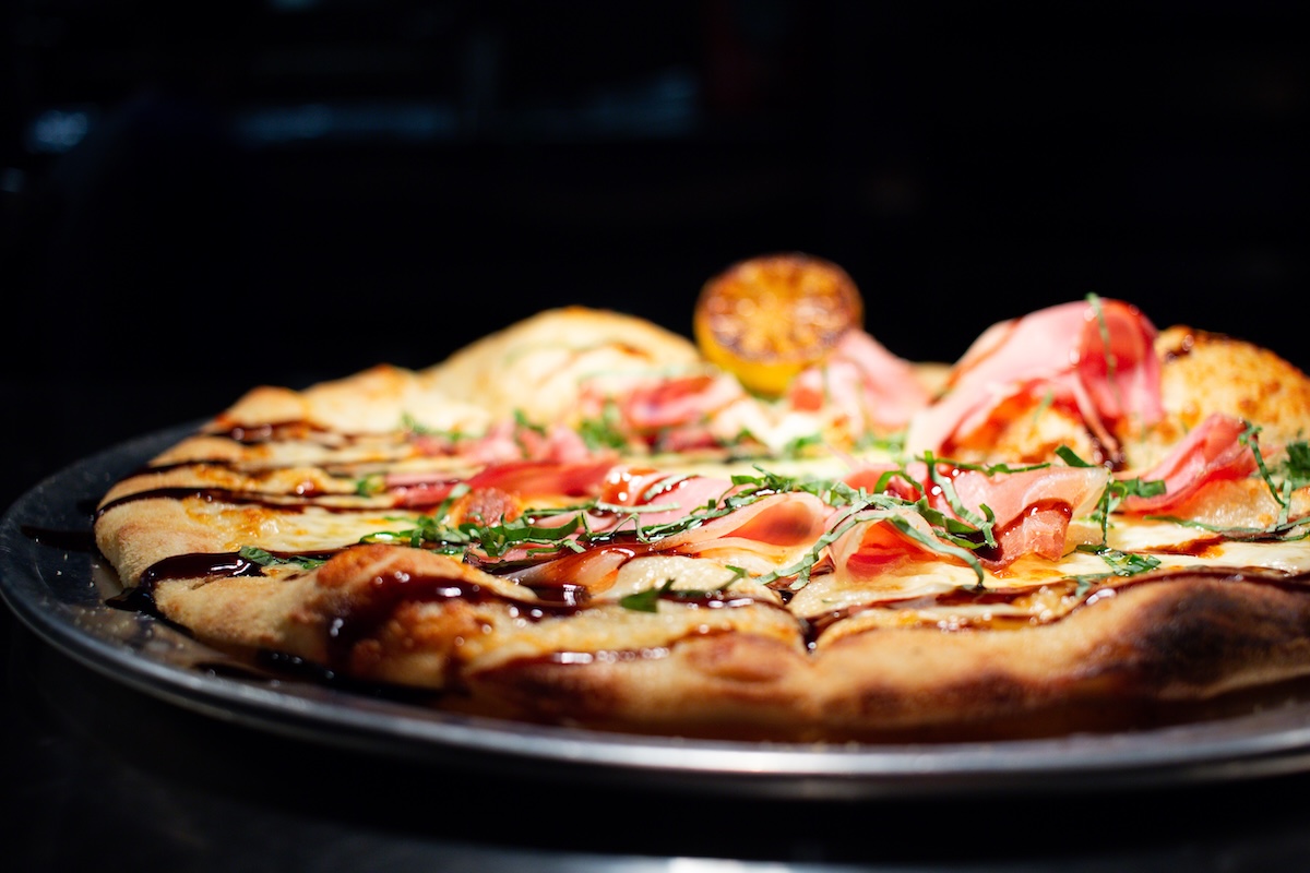 Prosciutto Pizza With Balsamic Drizzle_Courtesy of Leven Supply Prosciutto pizza with balsamic drizzle. Photo by Leven Supply