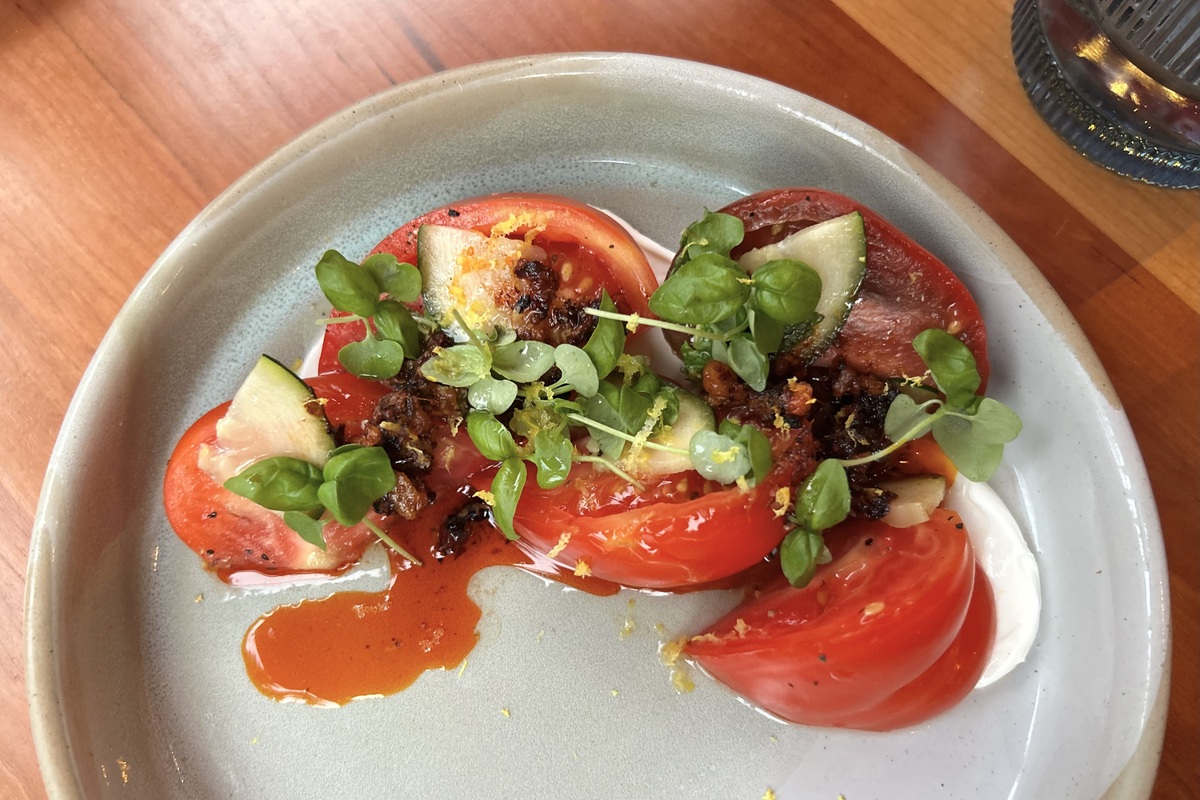Salsa macha adds a smoky spice to the Heirloom Tomato Salad | Photo by Abigail Bliss