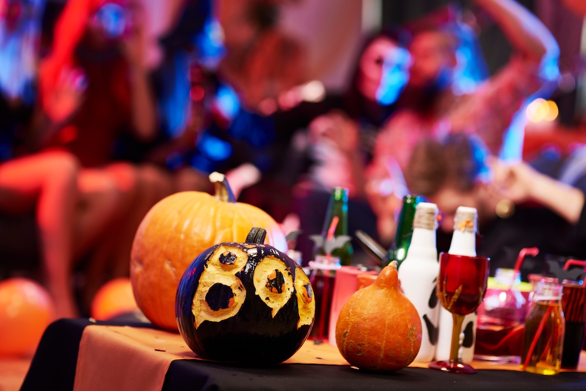 Table with many halloween decorations halloween party pumpkin carving denver stock
